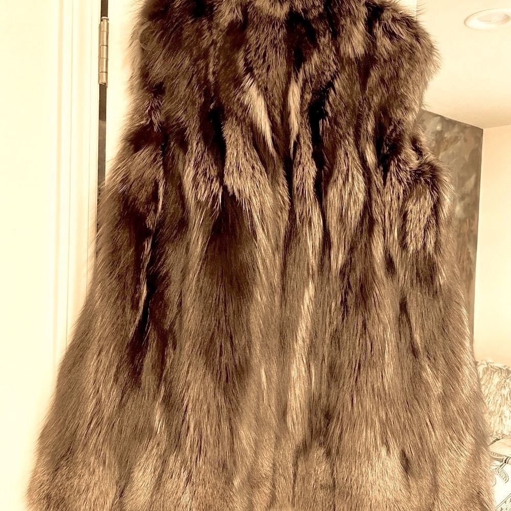 100% Real Raccoon 3/4 length fur vest. Hook closure. Excellent condition!!!